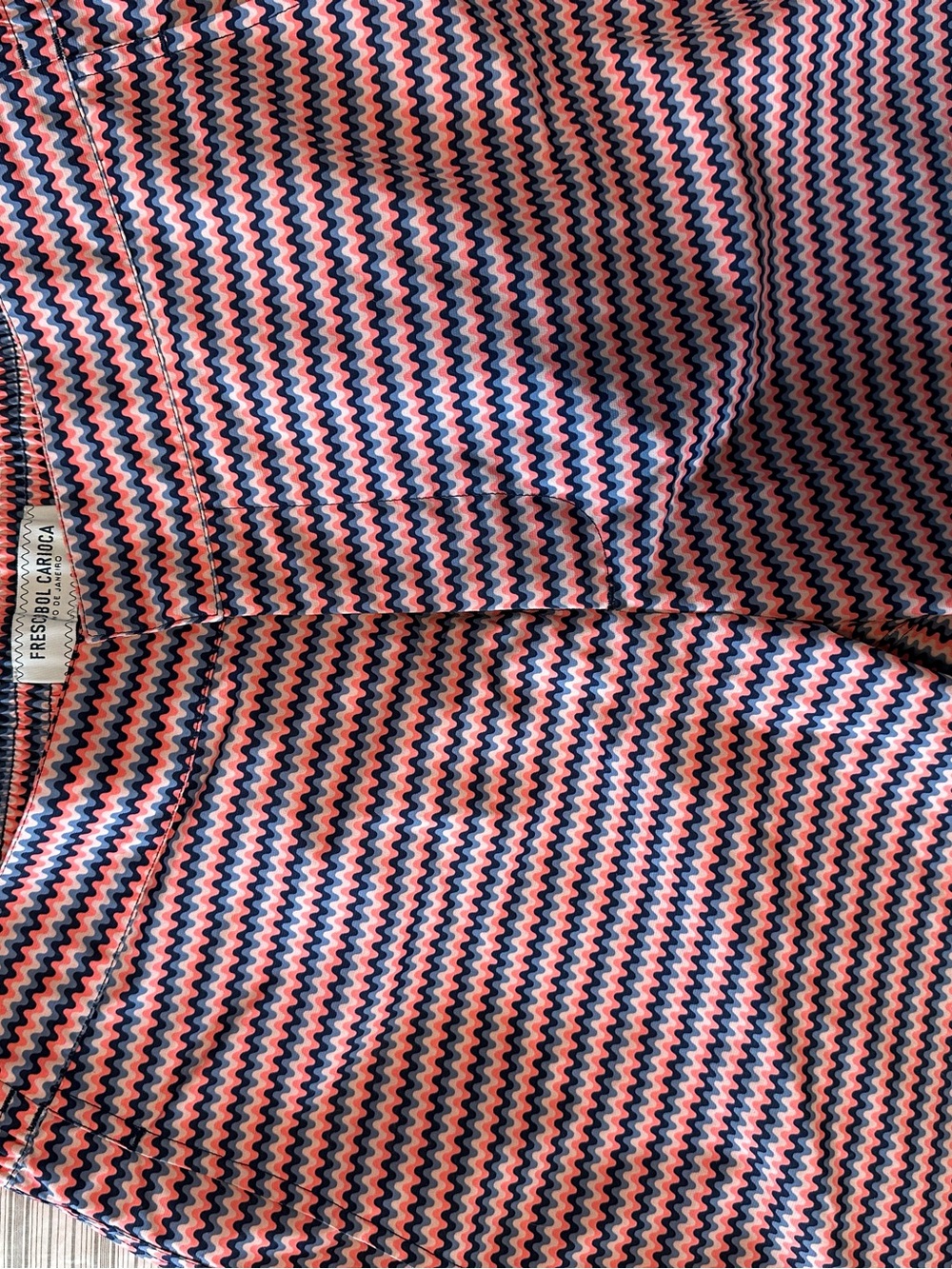 Luxury Brand Frescobol Carioca swim trunks feature a vibrant chevron pattern